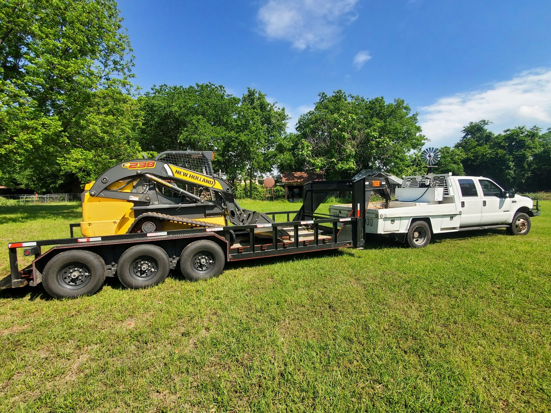 Truck and skid steer for land clearing